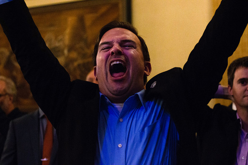 Charlie Poag, from Syracuse, celebrates at the Democratic watch party. 