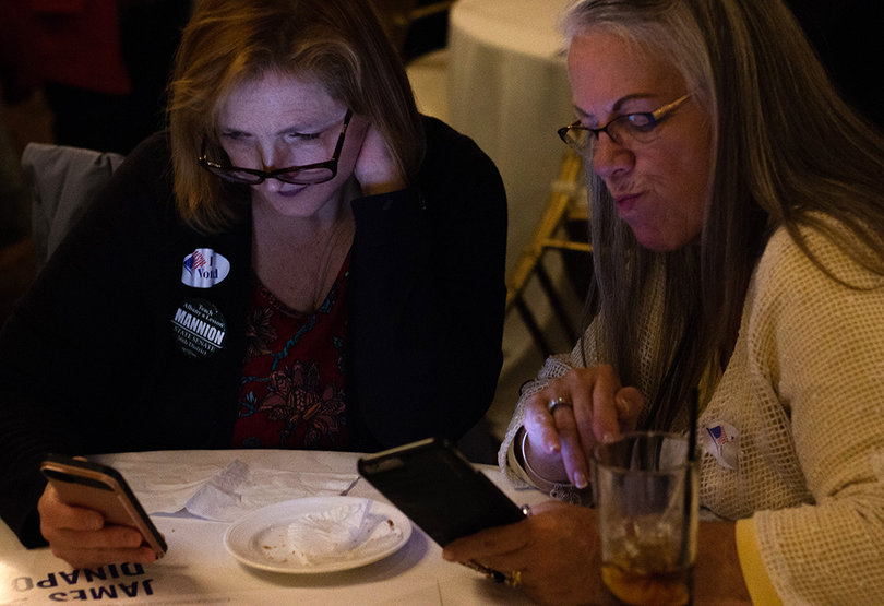 Monica Moore (left) and Bobbi Stafford (right)  anxiously wait for results to roll in.