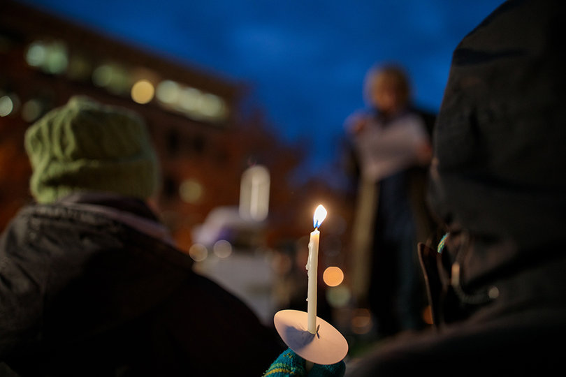 Protesters lit candles at the demonstration against President Donald Trump and his administration.