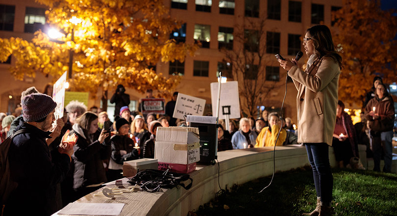 Grace Bobertz, a regional aide for Sen. Kirsten Gillibrand (D-N.Y.), reads a statement on behalf of the senator.