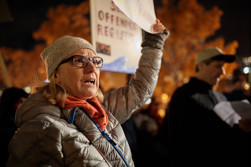 Denise Andovette, a retired special education teacher, chants "Two, four, six, eight, we don't want a facsist state," with other protesters at the rally.
