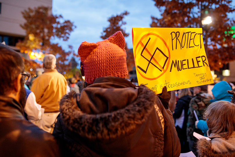Protesters gather in front of the James M. Hanley Federal Building on South Clinton Street to voice concerns about the resignation of Attorney General Jeff Sessions.