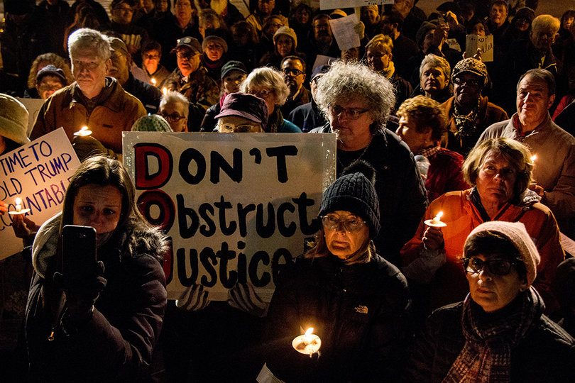 More than 100 people gathered in downtown Syracuse to protest the resignation of Attorney General Jeff Sessions. 