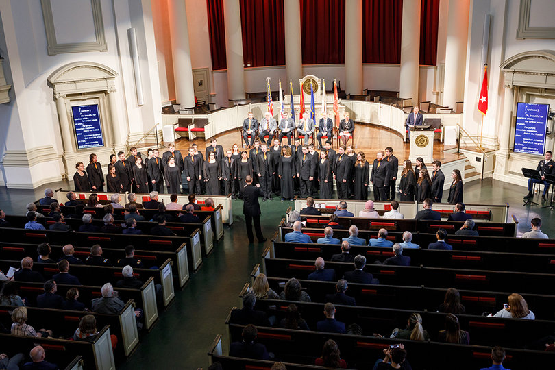 The Syracuse University Singers sing arrangements of  "Wade in the Water" and "America the Beautiful".