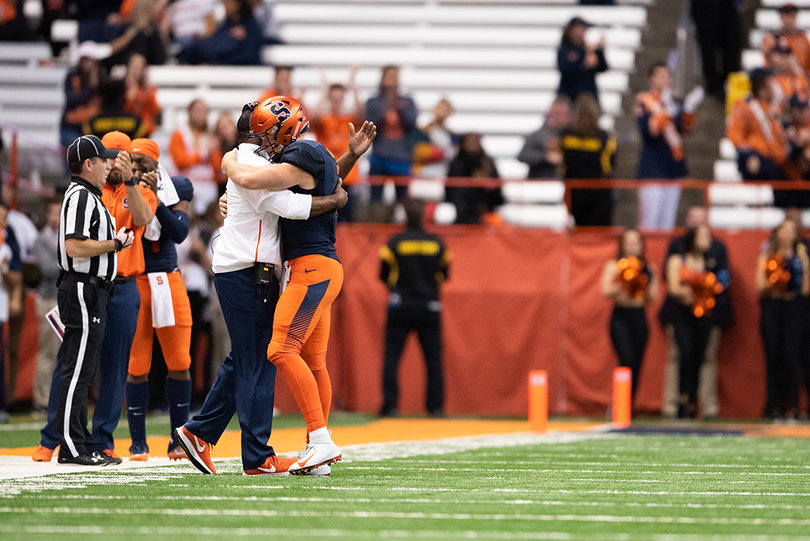 Dino Babers hugged Dungey after the quarterback came off the Carrier Dome turf for the final time. 