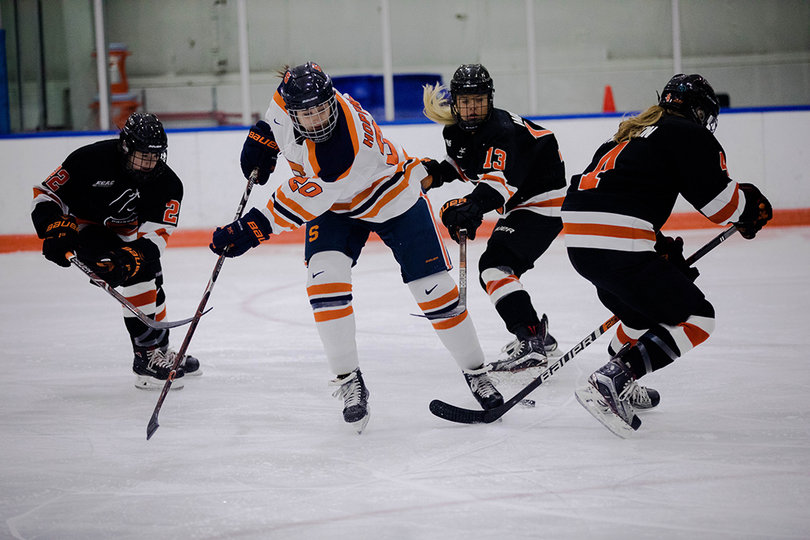 Anonda Hoppner (#20) took on three defensive players in an attempt to pass to an open teammate. 