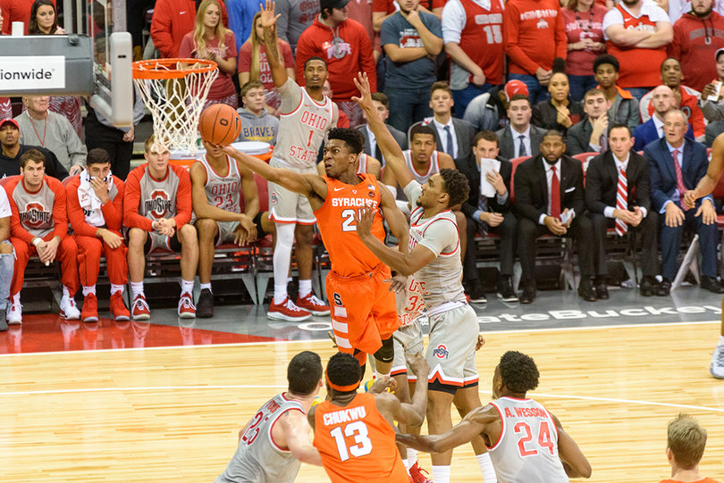 Battle takes layup through traffic.