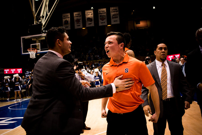 Syracuse celebrates following the win. 