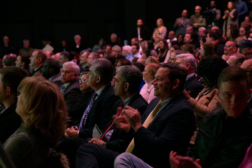 More than 200 people, including Chancellor Kent Syverud, gathered in the Redhouse Arts Center in downtown Syracuse.