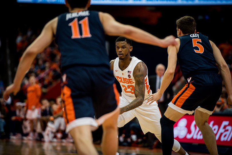 Ty Jerome (left) and Kyle Guy led UVA’s pack-line defense, and they also led the offense Monday. They helped UVA tie a school record of 18 3-pointers made.