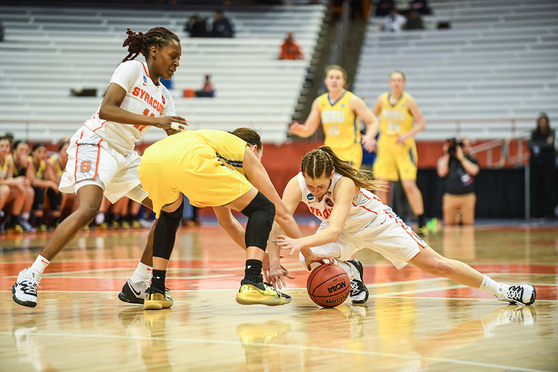 Players fight for a loose ball.