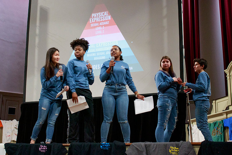 Several peer educators performed two skits used to explain prosocial bystander tactics to stop situations of slut and body shaming.