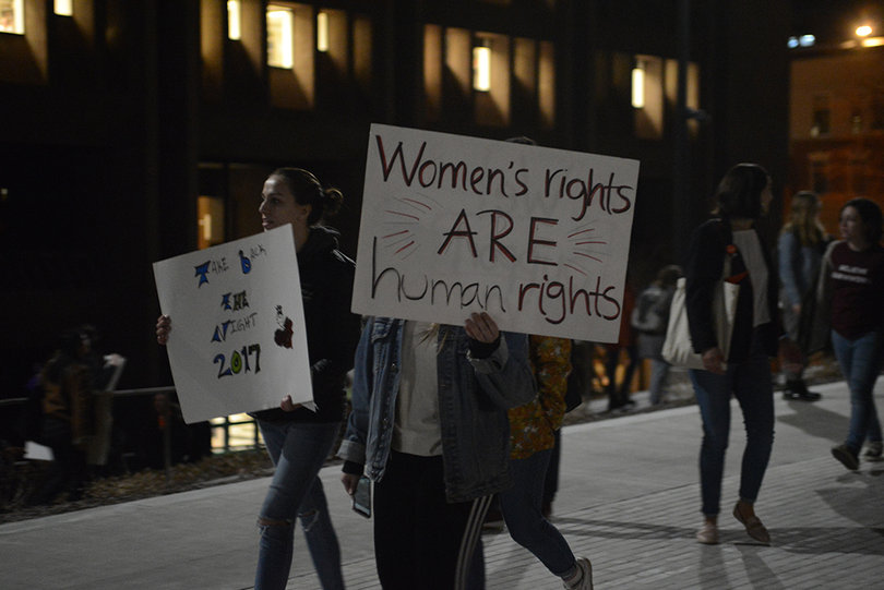 Several attendees carried signs during the march, which began and ended at Hendricks Chapel.