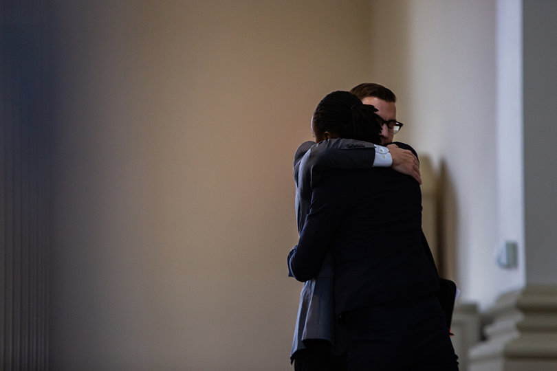 Dean Brian Konkol and Kelsey Davis embrace.