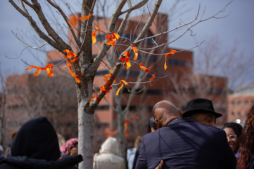Orange ribbons were tied around trees in front of Newhouse 3, a symbol of one of Branham's favorite colors. 