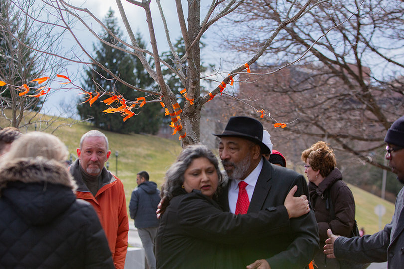 Tula Goenka, a television, radio and film professor in Newhouse, and Mel Williams hug.