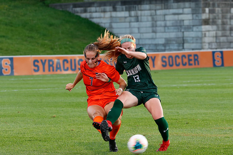 Bennett tries to gain possession of the ball in the match against Siena.