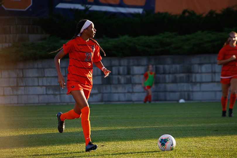 Junior Clarke Brown looks to pass the ball to a teammate during the match against Siena.