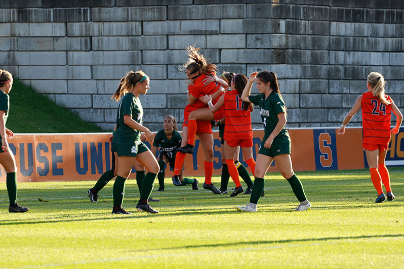 Bennett celebrates with her teammates after scoring the first goal of the night.