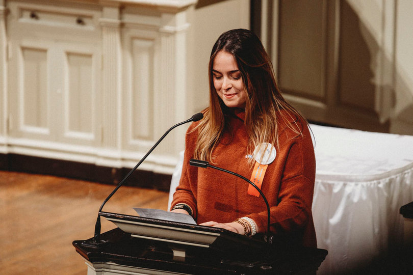 Scholar Allison Westbrook gives a speech as the representative of the 35 students.