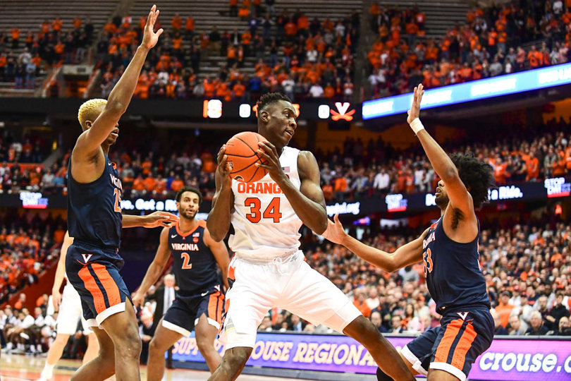 Bourama Sidibe gathers the ball in the paint.