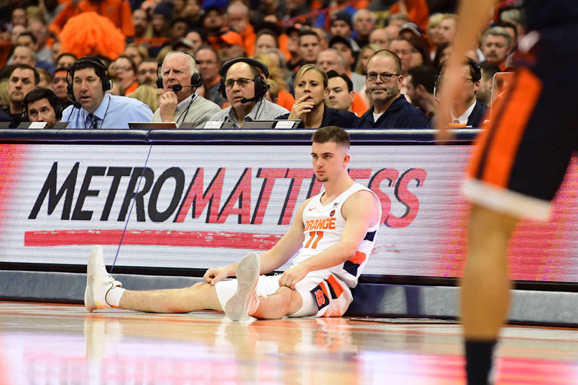 Joe Girard III sits in front of the scorer's table waiting to check in.