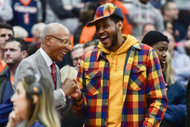 Carmelo Anthony smiles in the front row of the Carrier Dome