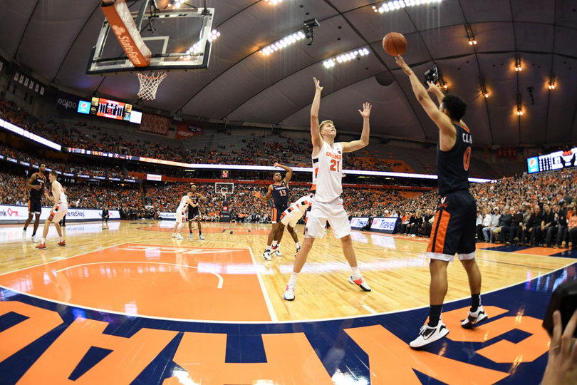 A UVA player throws an inbounds pass