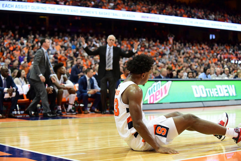 Elijah Hughes picks himself up off the court after getting fouled