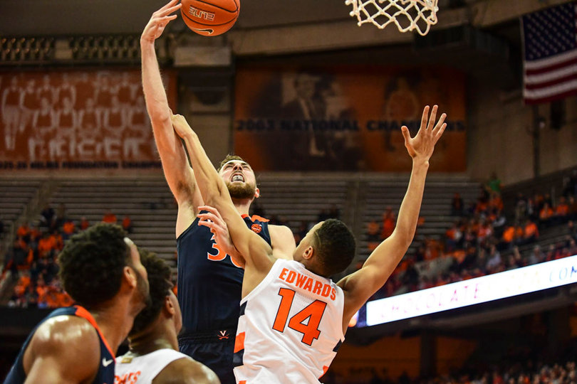 A UVA player skies for a rebound