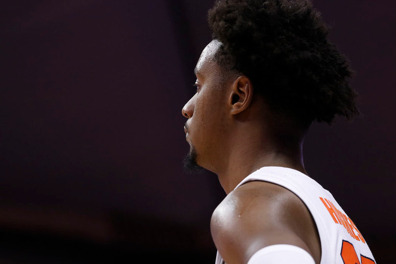 Elijah Hughes scored 14 points and made three 3s in the Orange's 16-point win.