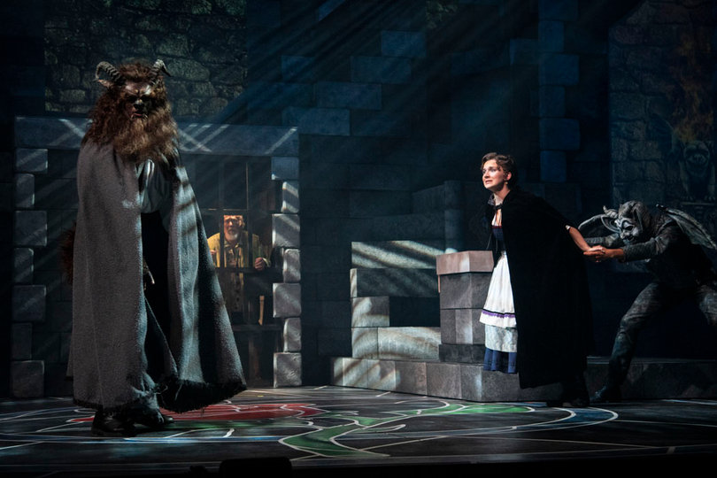 Stephanie Craven (right) as Belle, pleads  the Beast to let her father leave the castle. 