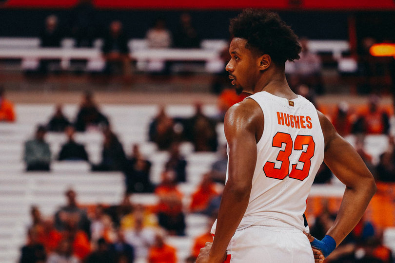 Elijah Hughes with his hand on his hip.