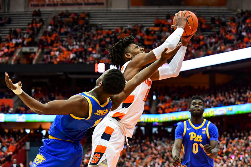 Quincy Guerrier dives toward the basket.