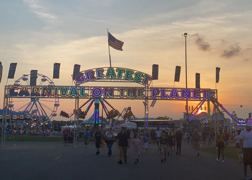 The entrance to the ride section of the New York State Fair reads "Greatest Carnival on the Planet."