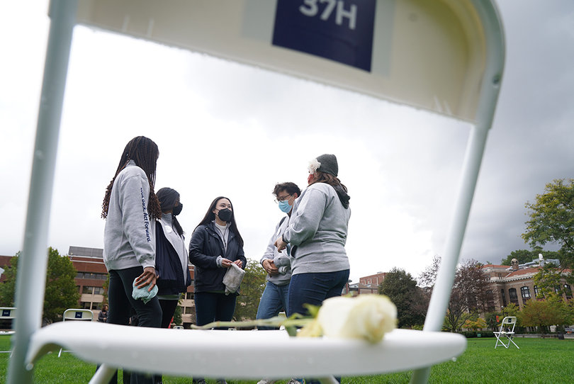 A group of Remembrance Scholars talk with one another before the "Sitting in Solidarity" ceremony begins.