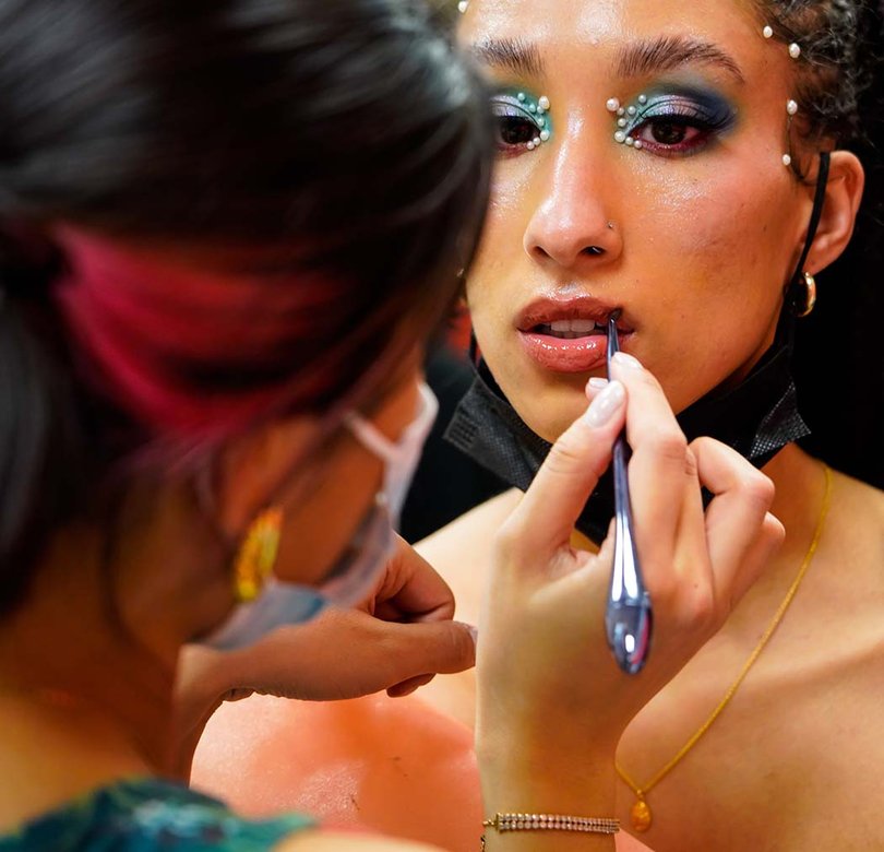 Fashion shows are about more than just clothes. It also takes hair and makeup in order to complete the desire look. 