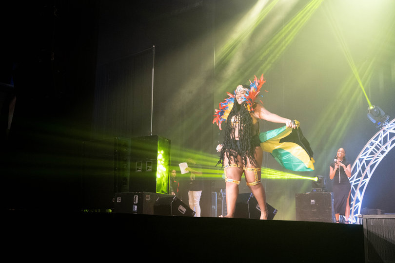 Milan Imari sports colorful Carnival wear with the Jamaican flag across her back.