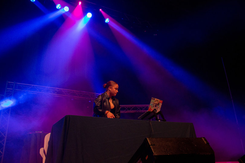 DJ Jill plays hit songs to get the crowd hyped and start off the night at Bandersnatch.
