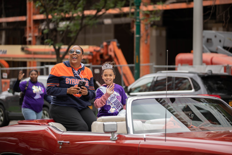 Felisha Legette-Jack sits in convertible with Miss Juneteenth during the Syracuse Juneteenth parade.