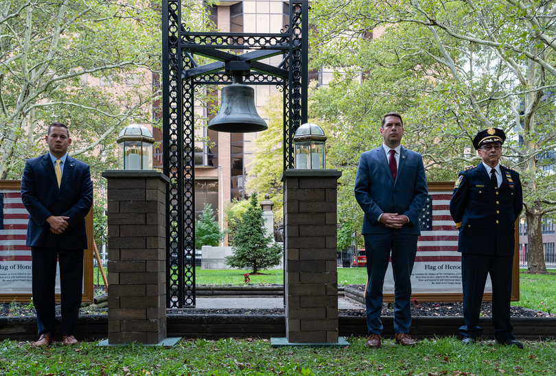 Ben Walsh, center, the mayor of Syracuse, stands alongside members of the Syracuse Police and Fire Departments during a memorial service in remembrance of the victims of the 9/11 attacks in Fayette Firefighters Park. 