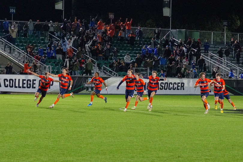 Nine out of the ten members chosen for the penalty kicks run to congratulate their teammate, Amferny Sinclair, after he kicked the game winning goal. Sinclair’s kick won Syracuse their first NCAA Men’s College Cup championship game. 