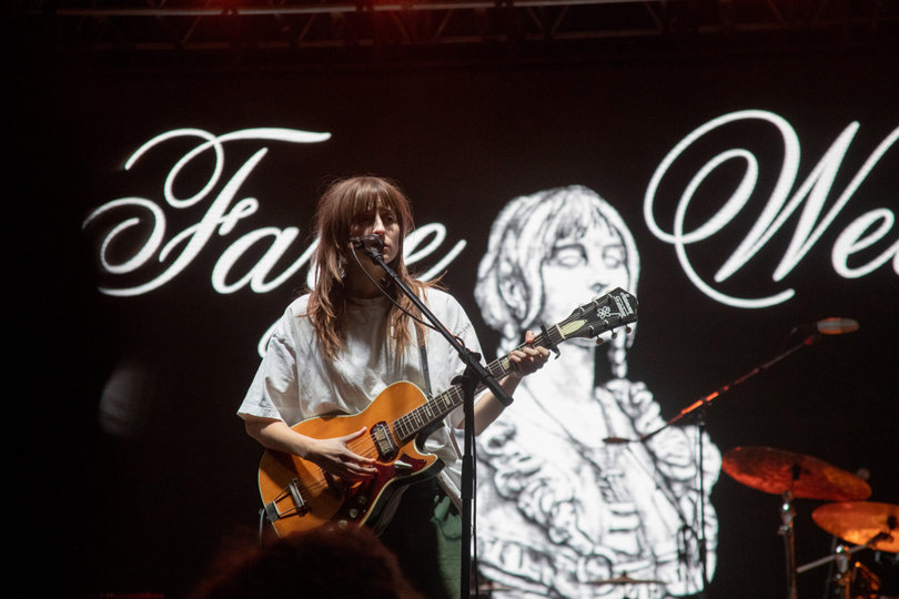 Faye Webster performs some of her most popular songs with her name and an artistic self-portrait displayed behind her. As the show went on, she became more conversational with the audience and took a fan’s BeReal.
