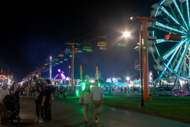 Lights from the rides and food stalls illuminate the paths of the Midway as the crowds start to dissipate. The sweet treat locations were the busiest locations at the end of the night as people looked to satisfy their sweet tooth before heading home. 
