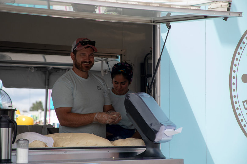 Peachey’s Baking Company is one of the many small food vendors to take up camp at the NY State Fair each year. Owner Dan Peachey worked with his team to produce fresh donuts and soft pretzels throughout the day for fairgoers to enjoy.
