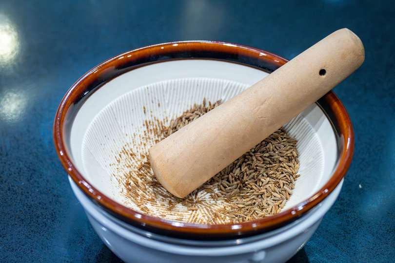 Spices in a grinding bowl.