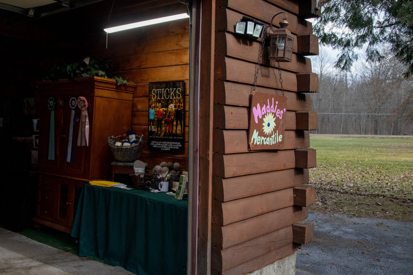 A shack with items for sale inside.