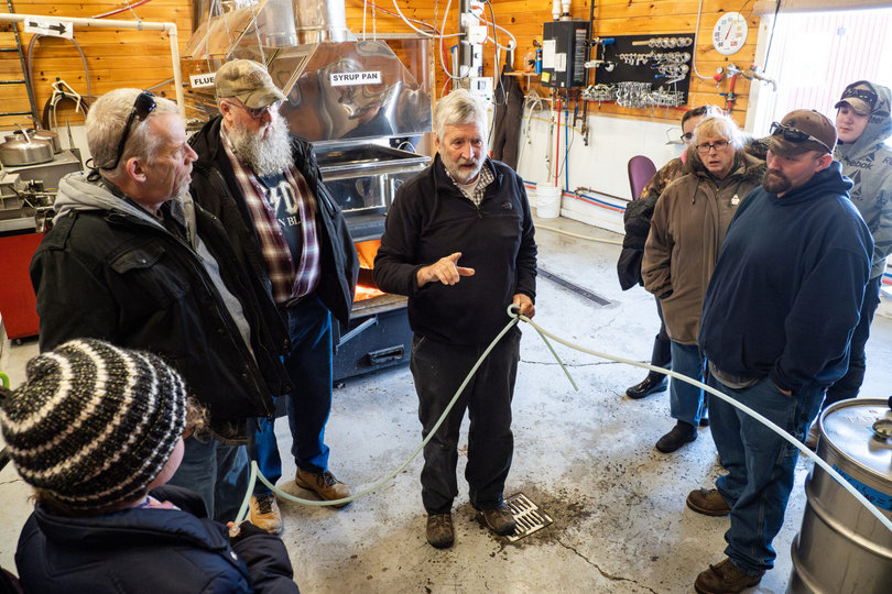 A man talking to a group of people.