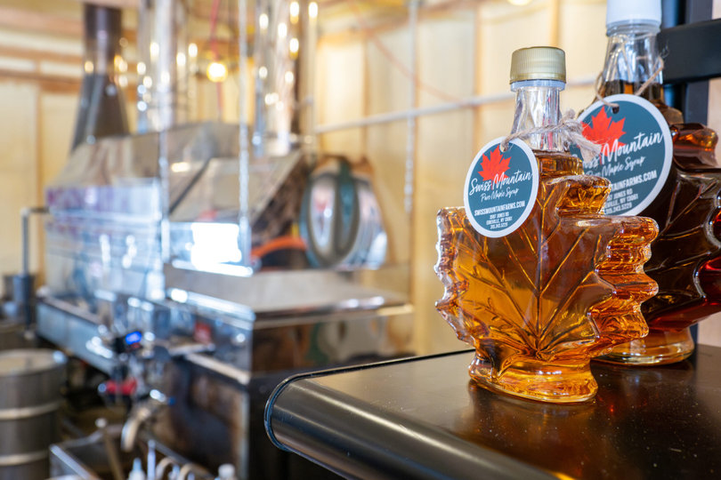 A machine with syrup bottles sitting on top.