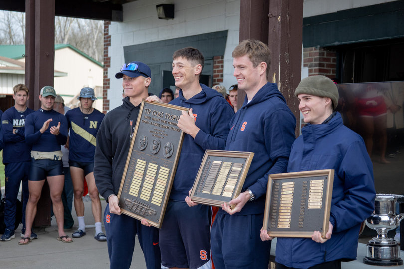 Three students with trophies